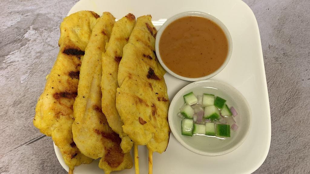 Chicken Satay · Chicken grilled on skewers served with specially prepared peanut sauce and sweet cucumber sauce.