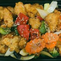 General Gau'S Chicken · Crispy chicken sautéed in spicy sweet general gau's sauce served with white rice, and side o...