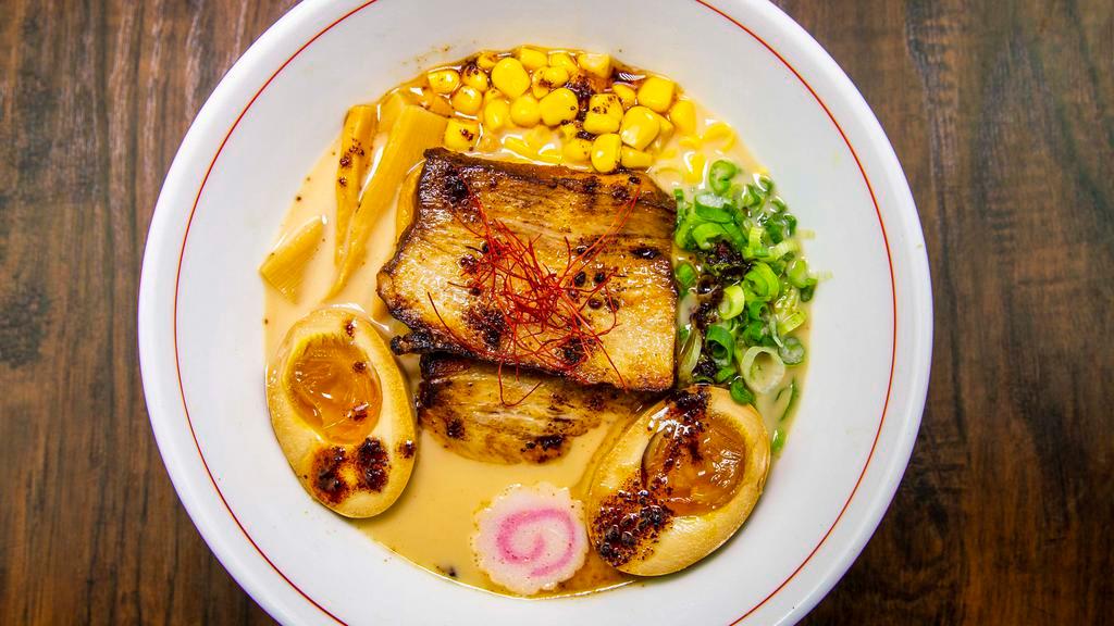Miso Ramen · Spicy. Rich pork broth seasoned with miso, marinated egg, pork belly, corn, scallions, nori, fishcake.