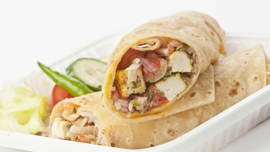 Paneer Tikka Roll · Indian cheese triangle marinated in yogurt, spices cooked, and wrapped in paratha. Served with chutney and house salad.