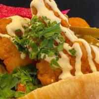 In A Pita Chicken Tenders · Our Award Winning fresh baked pita filled with chicken tenders, green salad, tahini sauce an...
