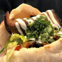 In A Pita Roasted Eggplant & Hard Boiled Egg ('Sabich') · Our Award Winning fresh baked pita with roasted eggplant & hard boiled eggs, green salad, ta...