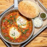 Traditional Shakshuka · 2 eggs poached in delicious tomato sauce, peppers, onions & garlic, pleasantly spiced with c...