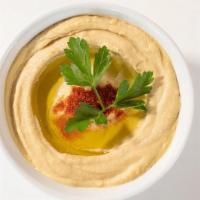 Traditional Hummus (8 Oz) · Homemade creamy hummus prepared daily - a top seller and a crowd favorite. Vegan.