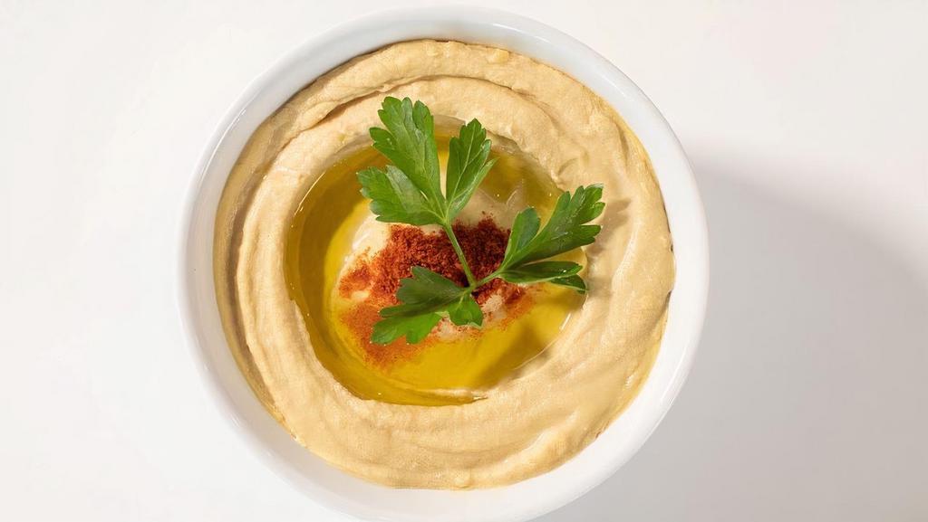 Traditional Hummus (8 Oz) · Homemade creamy hummus prepared daily - a top seller and a crowd favorite. Vegan.