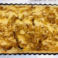 Onion Quiche · Baked savory pie, filled with slow cooked onions, fresh thyme, and light cream mixture. 5 Po...