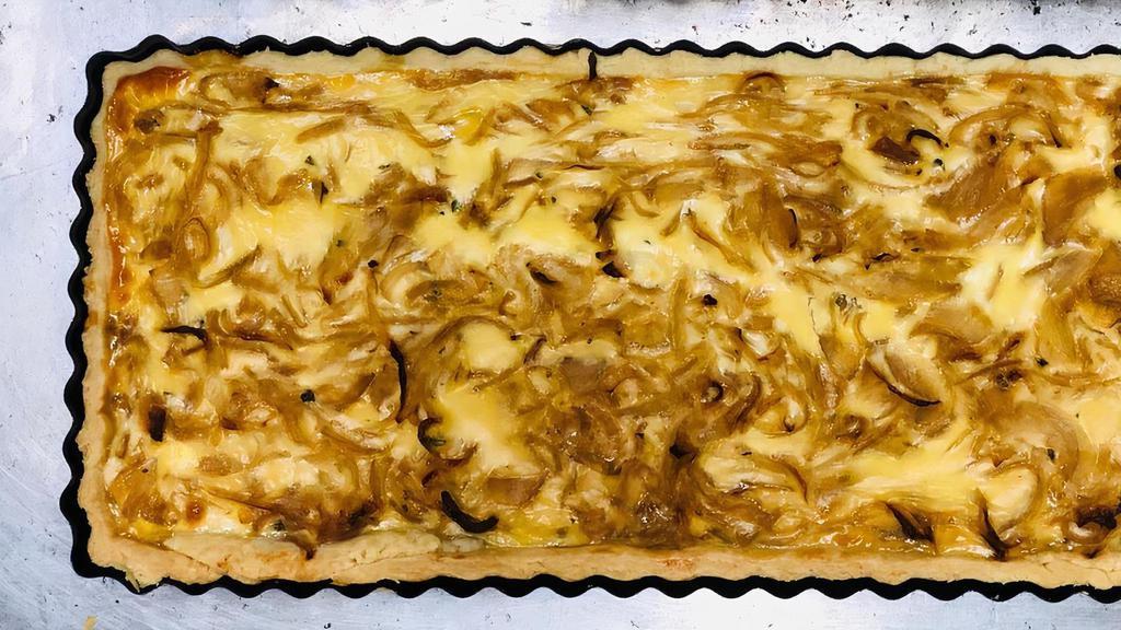 Onion Quiche · Baked savory pie, filled with slow cooked onions, fresh thyme, and light cream mixture. 5 Portions.