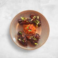 Korean Chicken Wings · fried chicken wings . sweet + spicy sauce.
pickled carrot garnish. scallions. sesame seeds