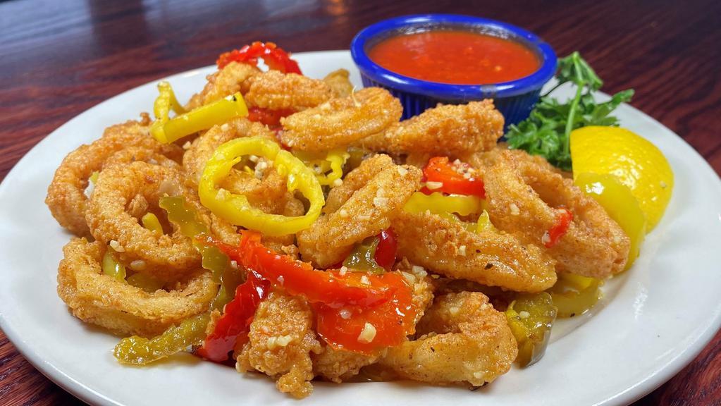 Fried Calamari · FRIED or RHODE ISLAND style
Rhode Island Style (pictured) is sautéed with spicy cherry peppers