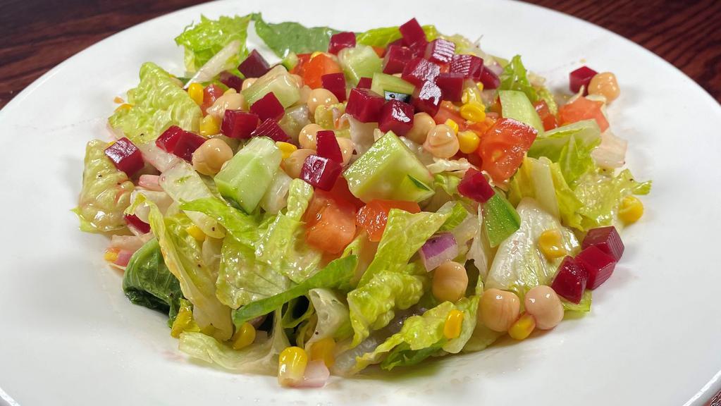 Chateau Chopped Salad Entrée  · chopped mixed lettuce, diced plum tomatoes, red onions, cucumbers, beets, chick peas, sweet corn, tossed in a poppy seed vinaigrette
