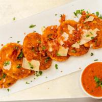 Jumbo Fried Ravioli (6) · Topped with prosciutto and vodka sauce.