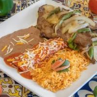 Carne Asada · Char broiled flank steak topped with poblano peppers and onions with one cheese enchilada an...