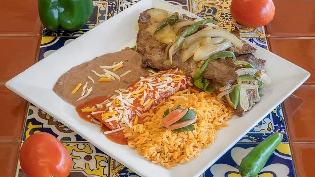 Carne Asada · Char broiled flank steak topped with poblano peppers and onions with one cheese enchilada and sauce. Rice, beans, salad, avocado, sour cream, and tortillas.