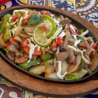 Alambre Mexicano · Steak, bacon, mushrooms, green peppers, jalapenos, and onions. Covered with Oaxaca cheese an...