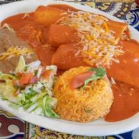 Enchiladas Rojas · Chicken or beef. Smothered in our special red sauce with cheese on top. Served with rice and...