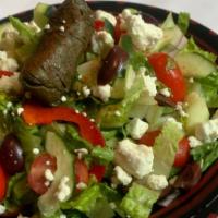 Mediterraean Salad · Romain hearts, olives, red peppers, cucumbers, tomatoes, grape leaves, feta, lemon-oil vinai...