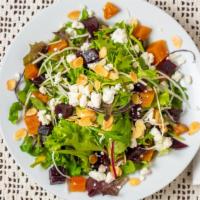 Beet & Almond Salad · Mixed Greens, Arugula, Roasted Beets, Toasted Almond, Goat Cheese, Lemon-Olive Oil Vinaigrette