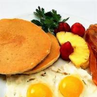 Chi Breakfast Deluxe · Choice of pancakes or French toast with two eggs and choice of bacon, sausage, ham or scrapp...