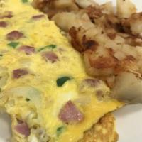 Western Omelette Breakfast · Ham, green pepper and onion. Made with three large fresh eggs. Served with homefries.