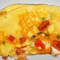 Tomato Omelette Breakfast · Made with three large fresh eggs. Served with homefries.