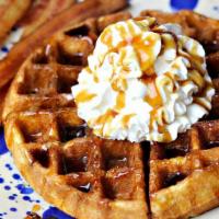 Waffle With Meat Breakfast · Served with butter and syrup, topped with powder sugar.