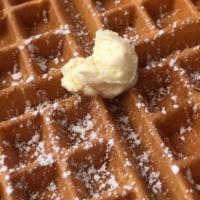 Waffle Breakfast · Served with butter and syrup, topped with powder sugar.