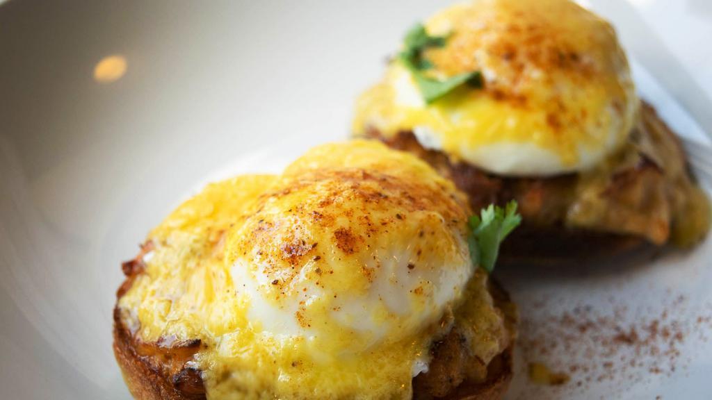 Crab Benedict Breakfast · Two poached eggs on top of our world famous jumbo lump cake and toasted English muffin, then topped with hollandaise sauce.