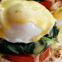Florentine Benedict Breakfast · Two poached eggs on top of sauteed spinach, grilled tomatoes and toasted English muffin, the...