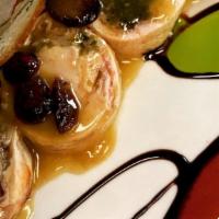 Involtini Di Pollo · Breast of chicken rolled with spinach, prosciutto and porcini mousse in a wine and vegetable...