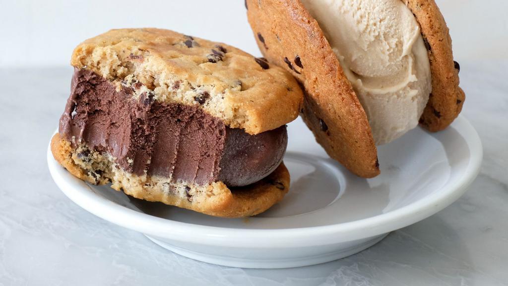 Chocolate Ice Cream Cookie Sandwich · home made chocolate chip cookies filled with chocolate ice cream.

All natural. vegan.
contains soy and coconut