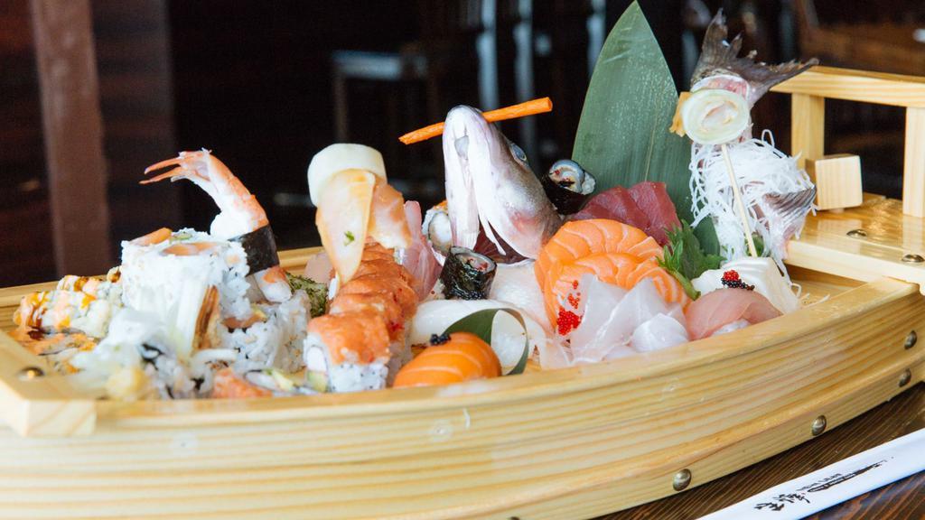 Chef’S Special Treasure Boat (Large) · 3 roll, eight pcs sushi and 20 pcs sashimi.