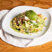 Salpicon Salad · Iceberg lettuce, pico de gallo, cucumbers, corn, avocado, radishes, queso fresco, with a tom...