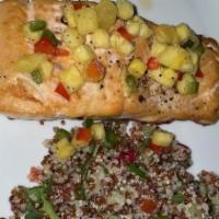 Salmon Al Tequila · Grilled salmon, topped with tequila pineapple salsa, served over arugula and quinoa salad wi...