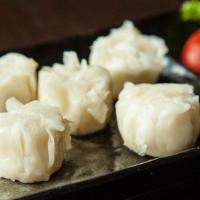 Shrimp Shumai · Steamed shrimp dumplings with pickled mustard seed and black vinegar soy sauce.