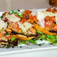 Bruschetta · Italian bread, lightly toasted with garlic & herbs, topped with finely diced tomatoes & fres...