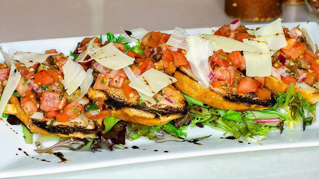 Bruschetta · Italian bread, lightly toasted with garlic & herbs, topped with finely diced tomatoes & fresh basil