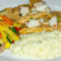Chicken Tre Famiglia · Sautéed with mushrooms, in a Marsala cream sauce with jumbo lump crabmeat with risotto and s...