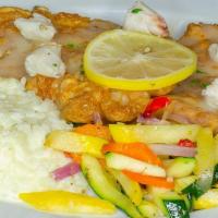 Flounder Francese · Fresh flounder, egg battered, served in a white wine-citrus sauce topped with jumbo lump cra...