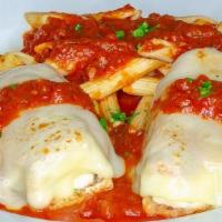 Eggplant Rollatini · Lightly breaded eggplant stuffed with ricotta, topped with mozzarella cheese, in marinara sa...