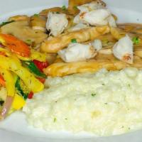 Veal Tre Famiglia · Sautéed with mushrooms, in a Marsala cream sauce with jumbo lump crabmeat with risotto and s...