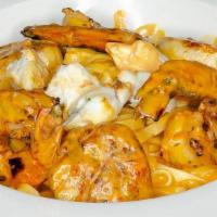 Linguine Aurora · Jumbo shrimp, scallops & jumbo lump crabmeat in a light tomato-cream sauce