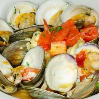 Linguine Clams · Succulent little neck clams simmered in garlic, tomato basil broth