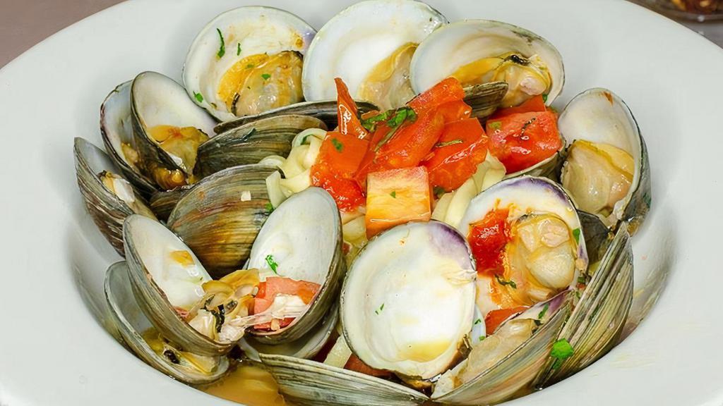 Linguine Clams · Succulent little neck clams simmered in garlic, tomato basil broth