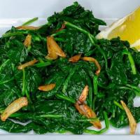 Side Spinach · Sautéed baby spinach with olive oil & garlic, served with fresh lemon
