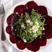 Roasted Beet Salad (Gf) · Fresh roasted beets, with goat cheese over baby arugula with balsamic reduction drizzle