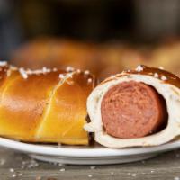 Hot Sausage · Beef Hot sausage wrapped in pretzel dough with salt.