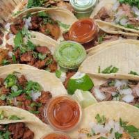 Taquiza !! · 15 tacos of your choice accompanied by sauces, limes, jalapenos, and radishes.