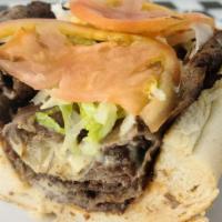 Steak Hoagie · Cheesesteak with American, Fried Onions, Lettuce and Tomatoes.