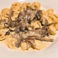 Tortellini Artu · Porchetta, wild mushrooms, cream.