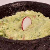 C: Guacamole · Traditional avocado dip with lime, cilantro, onions and chiles. Served with Chips and Salsa.